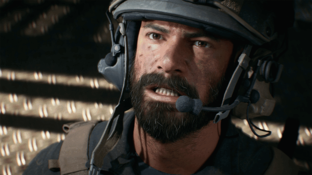 Nahaufnahme eines Soldaten mit Helm und Bart, der ernst aussieht und in einem Fahrzeug sitzt. Nahaufnahme eines Soldaten mit Helm und Bart, der ernst aussieht und in einem Fahrzeug sitzt.